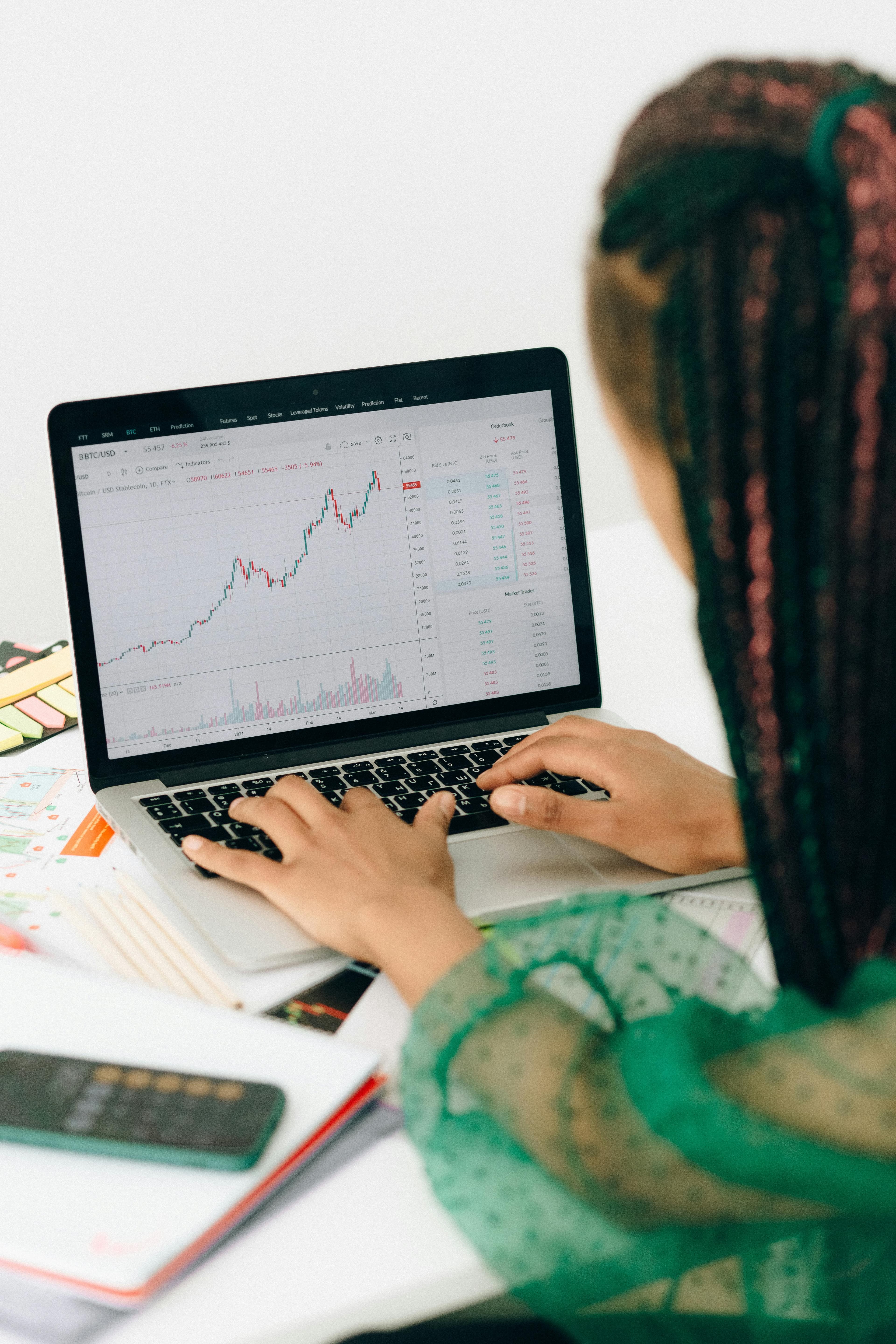 Professional woman trading on advanced platform